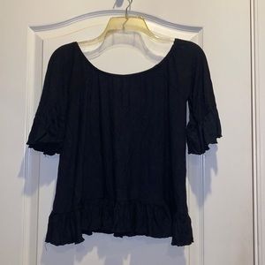 Super adorable black top.